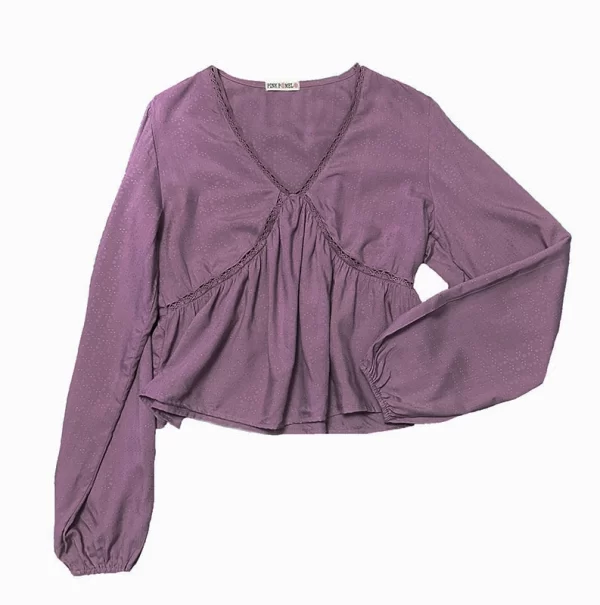 Blusa rosa viejo escote pico y amplia en el bajo, con intersecciones en costuras frontales y cuello. 100% Viscosa